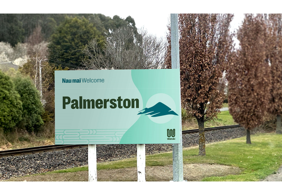 A sign with trees and grass

AI-generated content may be incorrect.