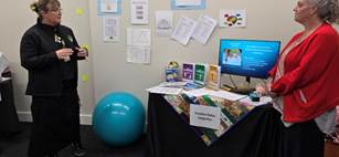 A desk with a computer and a ball

AI-generated content may be incorrect.